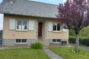 a house with a tree in front of it at La Maison des 3 Bouleaux in Lafeuillade-en-Vézie