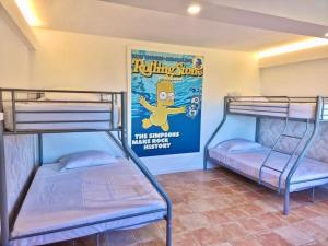 two bunk beds in a room with a poster on the wall at VILLA SOFIA in Valldemossa +118 photos