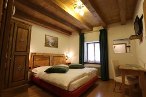Voodi või voodid majutusasutuse Albergo Centrale toas