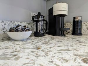 a counter top with a blender and a bowl on it at Robert Bolt House, Free Parking, 1 Minute to Metrolink in Sale