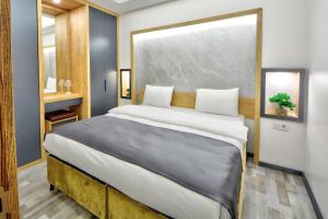 a bedroom with a large bed in a room at North Blue Life in Istanbul