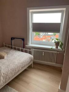 Postel nebo postele na pokoji v ubytování Appartement aan het strand in Zandvoort aan Zee!