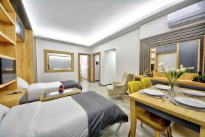 a hotel room with a bed and a dining room at North Blue Life in Istanbul