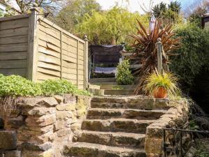 a set of stone stairs in a garden at Valley View in Belper