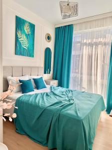 Postel nebo postele na pokoji v ubytování BATUMI BOULEVARD RESORT