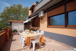 a table and chairs on the patio of a house at Casa Nicolò in Massa Lubrense