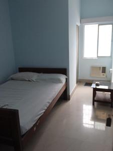 Postel nebo postele na pokoji v ubytování Centerpoint Guest House