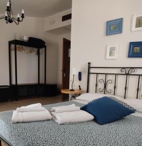 a bedroom with two beds and two pillows on it at Supramurgia Agribistrot in Cassano delle Murge