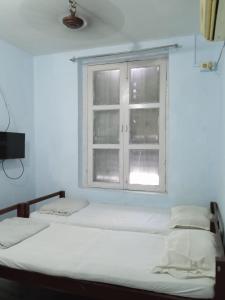 Postel nebo postele na pokoji v ubytování Centerpoint Guest House