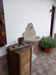 a bathroom with a sink on a wooden table at Maison Diletta in Castelletto sopra Ticino
