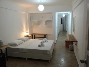 Postel nebo postele na pokoji v ubytování Pataros Hotel