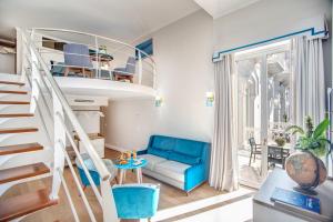 a room with a bunk bed and a blue couch at Hotel Mediterraneo in Sant'Agnello
