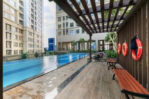 a swimming pool in a building with buildings at Saigon Royal Apartment 3 bedrooms 4 beds for 30 nights stay above in Ho Chi Minh City