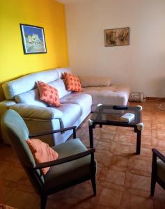 a living room with a couch and a table at AMPOLLA in L'Ampolla