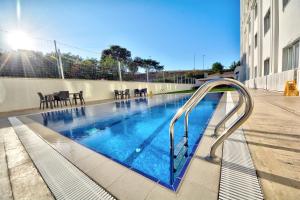 a swimming pool with a slide in a building at North Blue Life in Istanbul