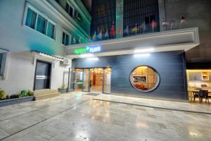 a lobby of a building with a round doorway at North Blue Life in Istanbul