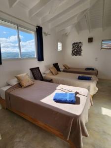 Postel nebo postele na pokoji v ubytování Exceptionnelles vue mer et villa