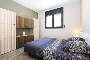 a bedroom with a bed and a window at Villa Esperanza in Vidreres +27 photos