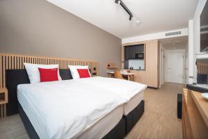 Kuchyň nebo kuchyňský kout v ubytování Tailormade Hotel BAB Bachenbülach
