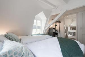เตียงในห้องที่ Stadthaus Monschau (22 Gäste)