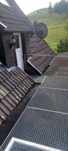 an array of solar panels on the roof of a house at Haus auf den oberen Hexenstieg in Osterode
