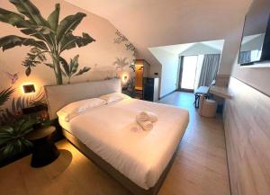 Een bed of bedden in een kamer bij Hotel Delfin Azul