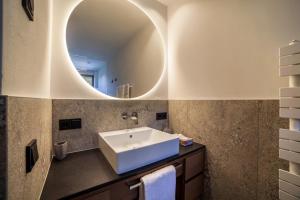 a bathroom with a sink and a mirror at Natur Romantik Apartment Annalena in Castelbello-ciardes +16 photos