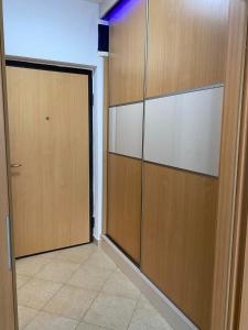 a hallway with a door and a door at Danka Szálláshely in Debrecen +9 photos