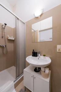 a bathroom with a sink and a shower at My city apartment vienna- one Bedroom in Vienna