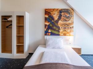 Postel nebo postele na pokoji v ubytování B&B Hotel Bayreuth