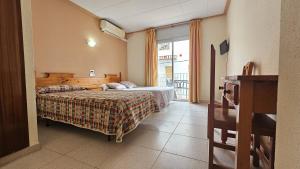 Posteľ alebo postele v izbe v ubytovaní Hostal Los Maños