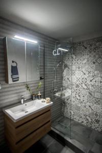 a bathroom with a sink and a shower at City Loft 2 (Stamatina's Luxury Apartments) in Alexandroupoli