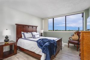 a bedroom with a bed and a large window at Our House at the Beach W-Tower 5th Fl in Siesta Key +41 photos