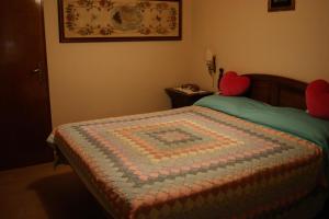 Un pat sau paturi într-o cameră la RomaInvilla