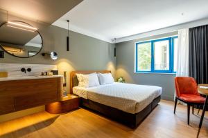Letto o letti in una camera di Bob W Eolou
