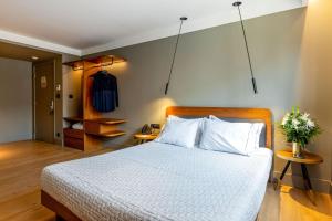Letto o letti in una camera di Bob W Eolou