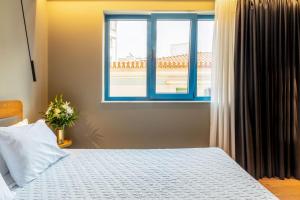 Letto o letti in una camera di Bob W Eolou