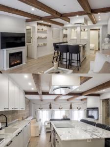 a kitchen and living room with white cabinets at Casa MIMOSA Vigo in Vigo