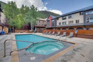 a swimming pool in the middle of a building at Bright Downtown Telluride Condo - Steps to Lift! in Telluride