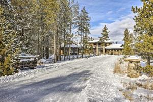 a snow covered road in front of a lodge at Cozy Fraser Cabin with Views and Moose Sightings! in Fraser