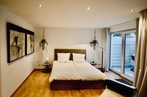 Кровать или кровати в номере Wannseeresidenz