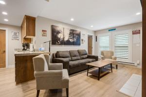 a living room with a couch and a table at Ski-Out Brian Head Condo - Top of Navajo Lift in Brian Head