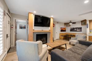 a living room with a couch and a fireplace at Ski-Out Brian Head Condo - Top of Navajo Lift in Brian Head