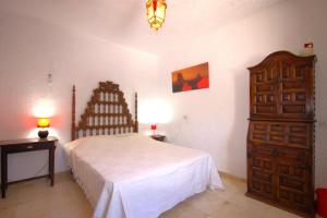 Ein Bett oder Betten in einem Zimmer der Unterkunft Holiday Home La Cartuja