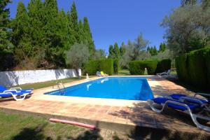 Der Swimmingpool an oder in der Nähe von Holiday Home La Cartuja