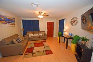 a living room with a couch and a table at Home Sweet Home - Peace, Love, & Enjoy in Kingsville