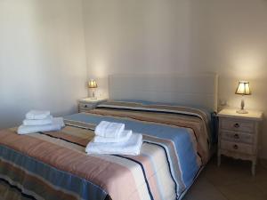 Ένα ή περισσότερα κρεβάτια σε δωμάτιο στο Casa vacanze Elsa