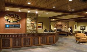 a lobby of a hotel with a bar and a casino at Wyndham Glacier Canyon 2 BR in Baraboo