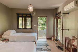 Postel nebo postele na pokoji v ubytování Re Connect Pai - Keys Resort + 33 fotografií