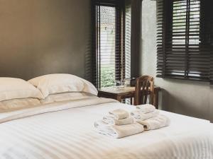 Re Connect Pai - Keys Resort客房内的一张或多张床位